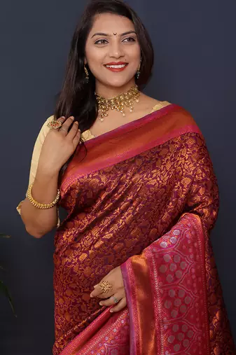 Wine banarasi silk blend saree with rani pink zari border & woven pallu