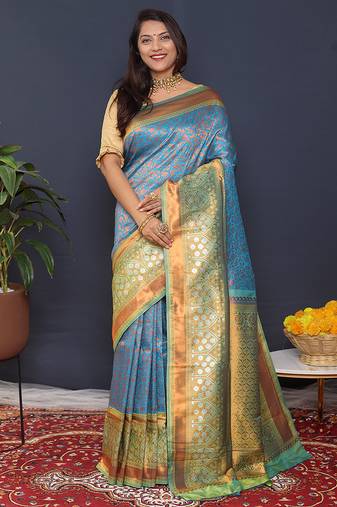 Sky blue banarasi silk blend saree with mint green zari border & woven pallu