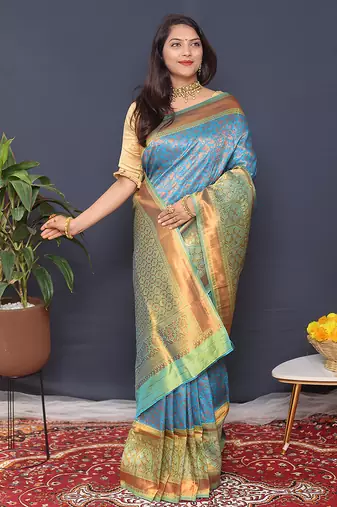 Sky blue banarasi silk blend saree with mint green zari border & woven pallu