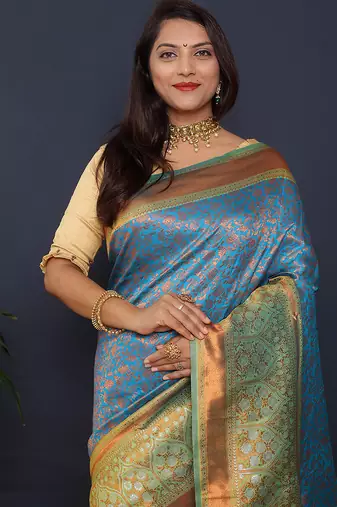 Sky blue banarasi silk blend saree with mint green zari border & woven pallu