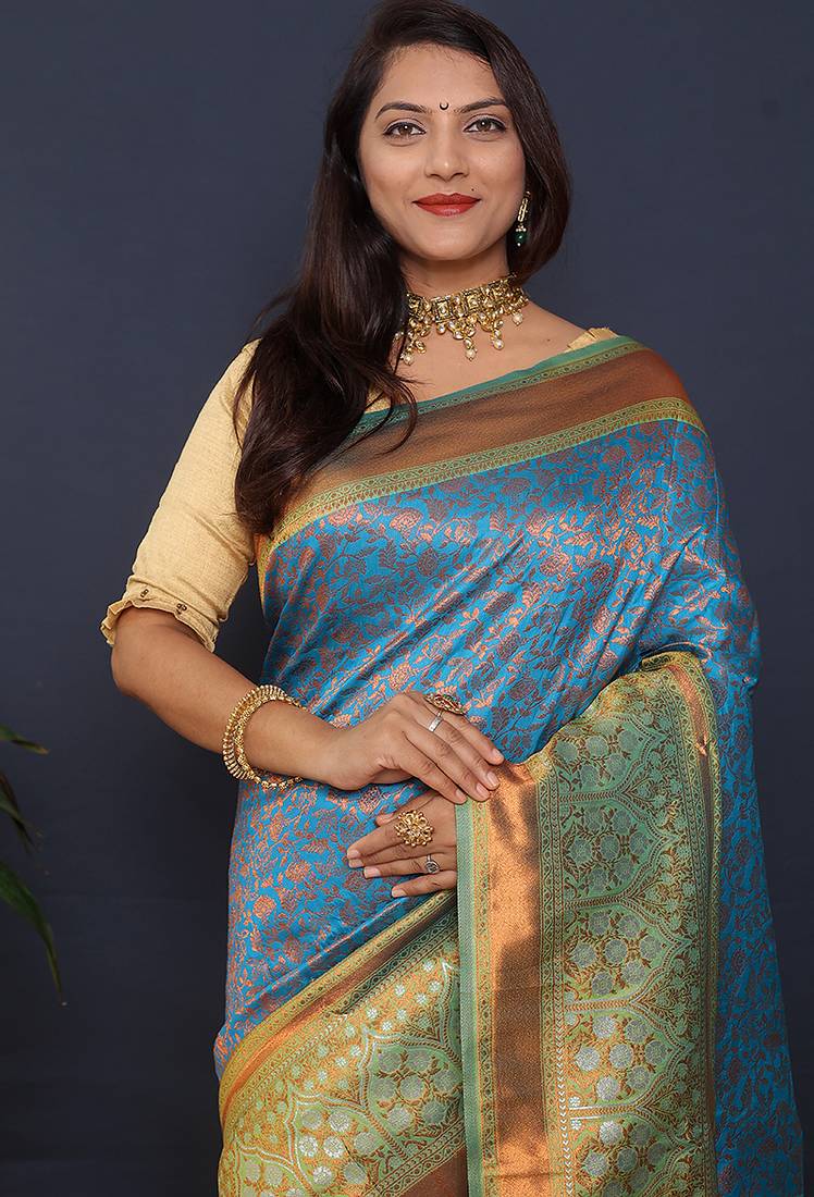Sky blue banarasi silk blend saree with mint green zari border & woven pallu