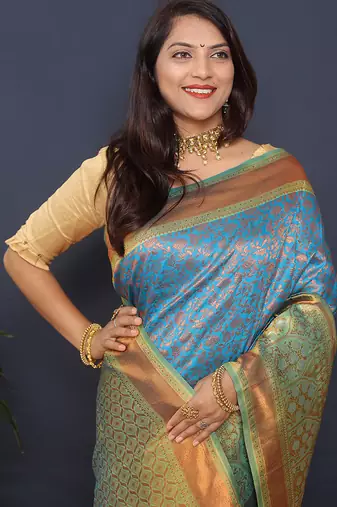 Sky blue banarasi silk blend saree with mint green zari border & woven pallu