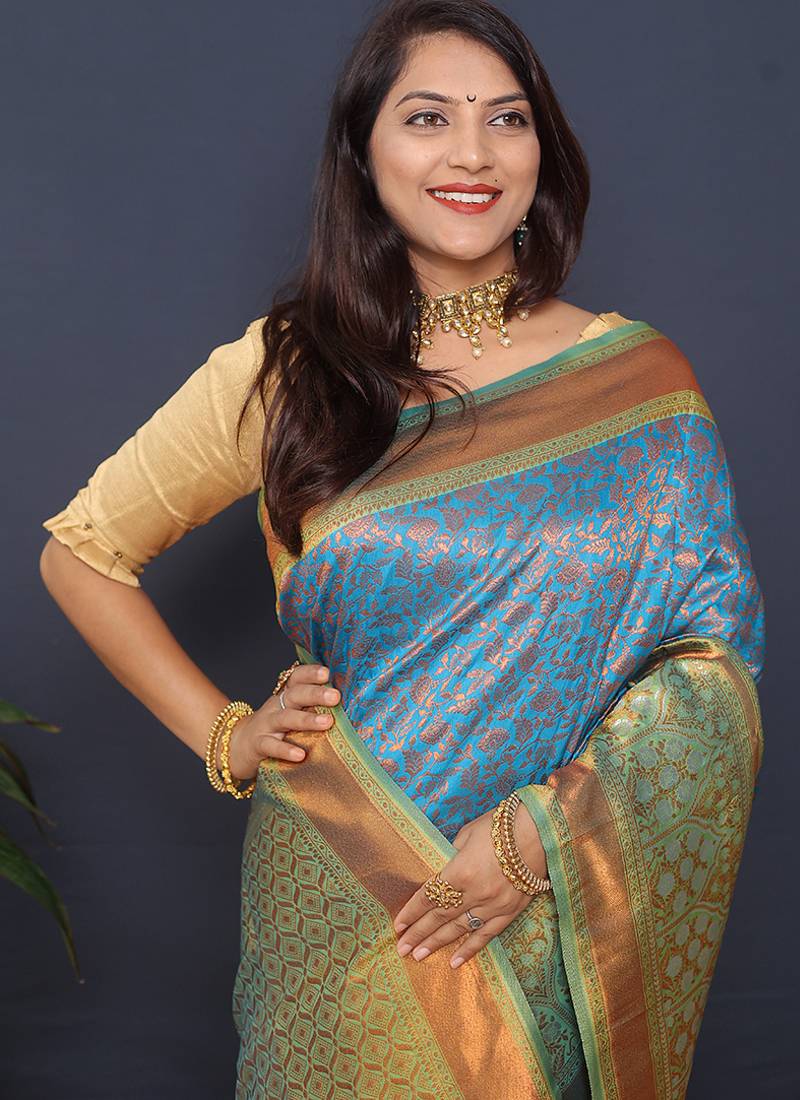 Sky blue banarasi silk blend saree with mint green zari border & woven pallu