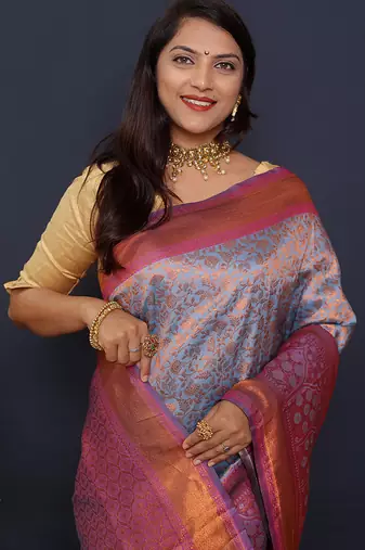 Greyish blue banarasi silk blend saree with pink zari border & woven pallu