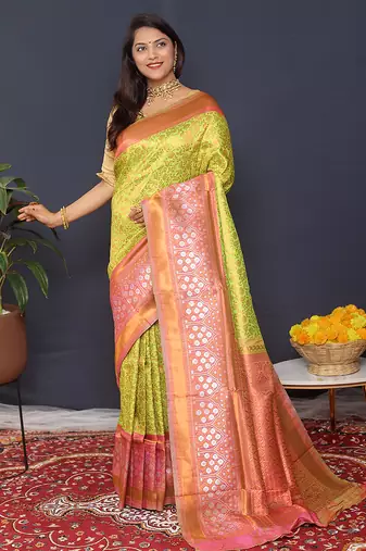 Parrort green banarasi silk blend saree with peach pink zari border & woven pallu