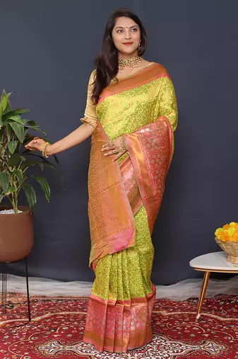 Parrort green banarasi silk blend saree with peach pink zari border & woven pallu