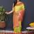 Parrort green banarasi silk blend saree with peach pink zari border & woven pallu
