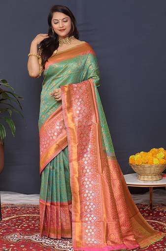 Sea green banarasi silk blend saree with coral  pink zari border & woven pallu