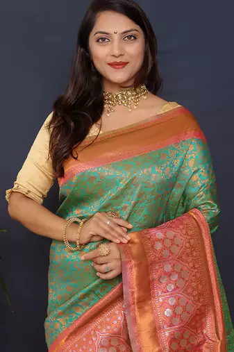 Sea green banarasi silk blend saree with coral  pink zari border & woven pallu