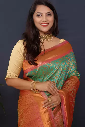 Sea green banarasi silk blend saree with coral  pink zari border & woven pallu