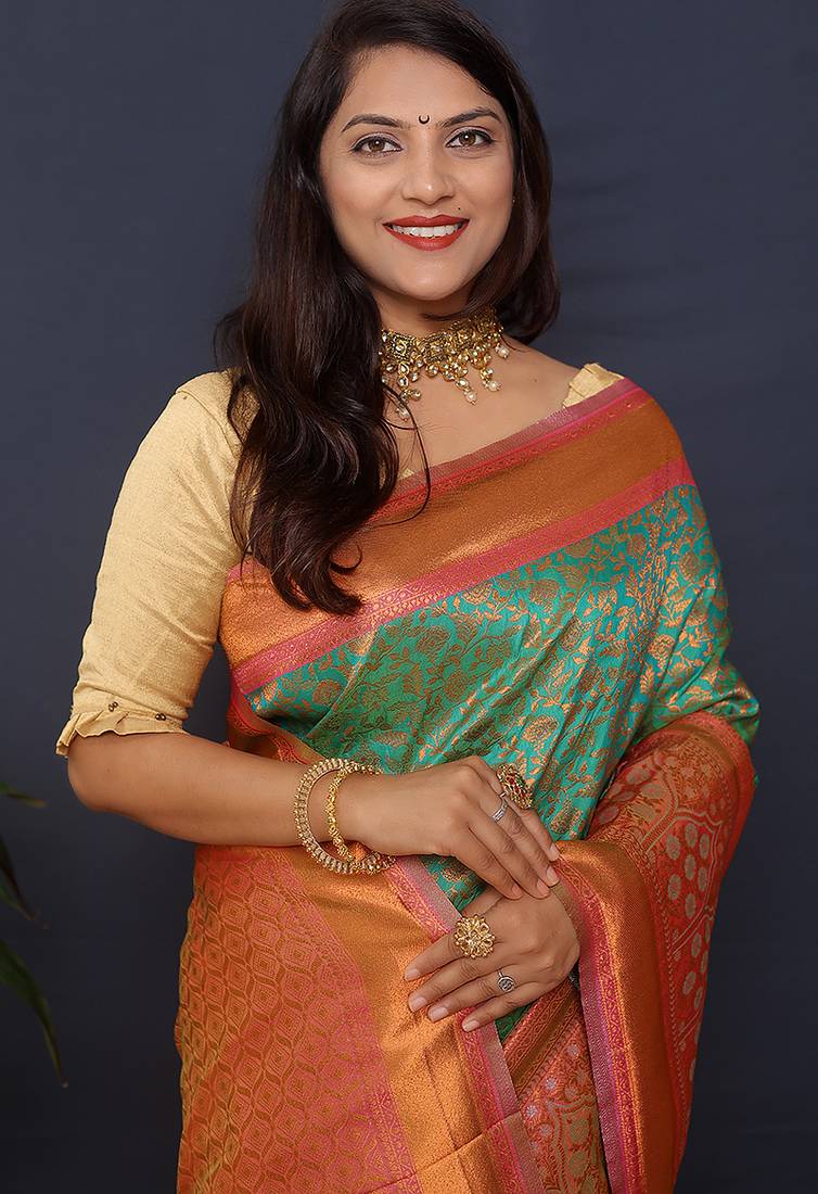 Sea green banarasi silk blend saree with coral  pink zari border & woven pallu