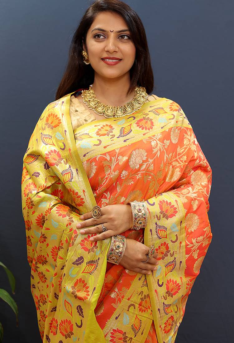 Orange banarasi silk blend saree with multi-color meenakari floral border
