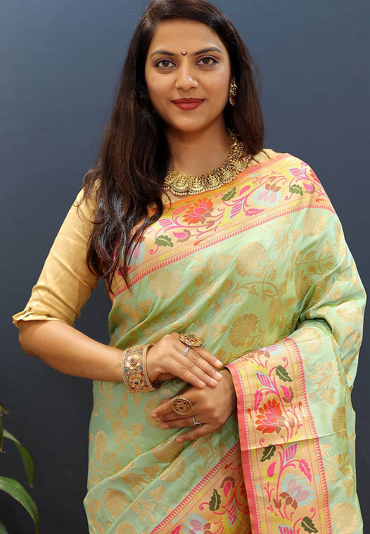 Mint green banarasi silk blend saree with multi-color meenakari floral border