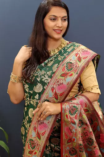 Dark green banarasi silk blend saree with multi-color meenakari floral border