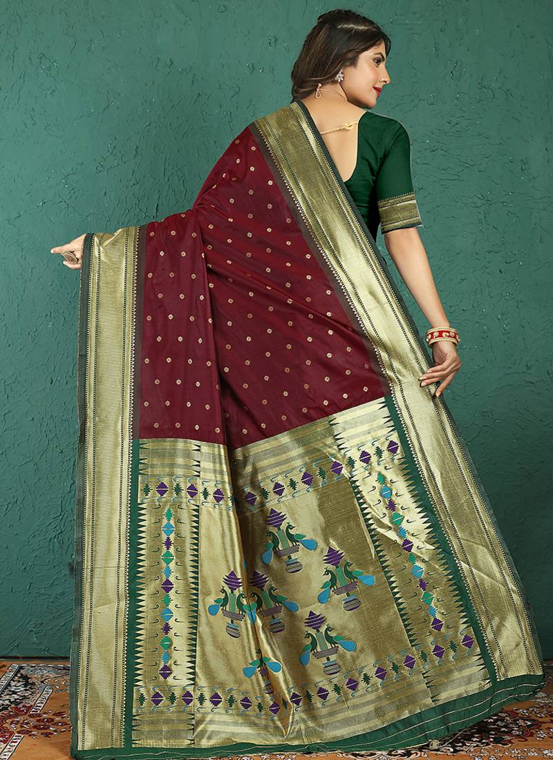 Maroon banarasi silk blend saree with zari weaving & dark green paithani border