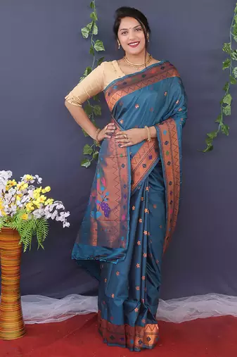 Teal blue banarasi silk blend saree with copper zari butti & geometric woven border