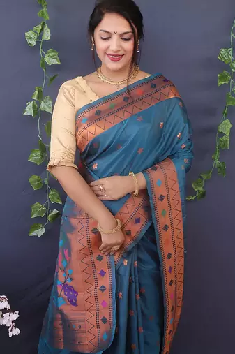 Teal blue banarasi silk blend saree with copper zari butti & geometric woven border