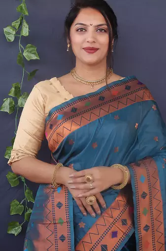 Teal blue banarasi silk blend saree with copper zari butti & geometric woven border