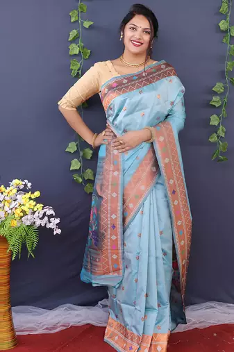 Sky blue banarasi silk blend saree with copper zari butti & geometric woven border