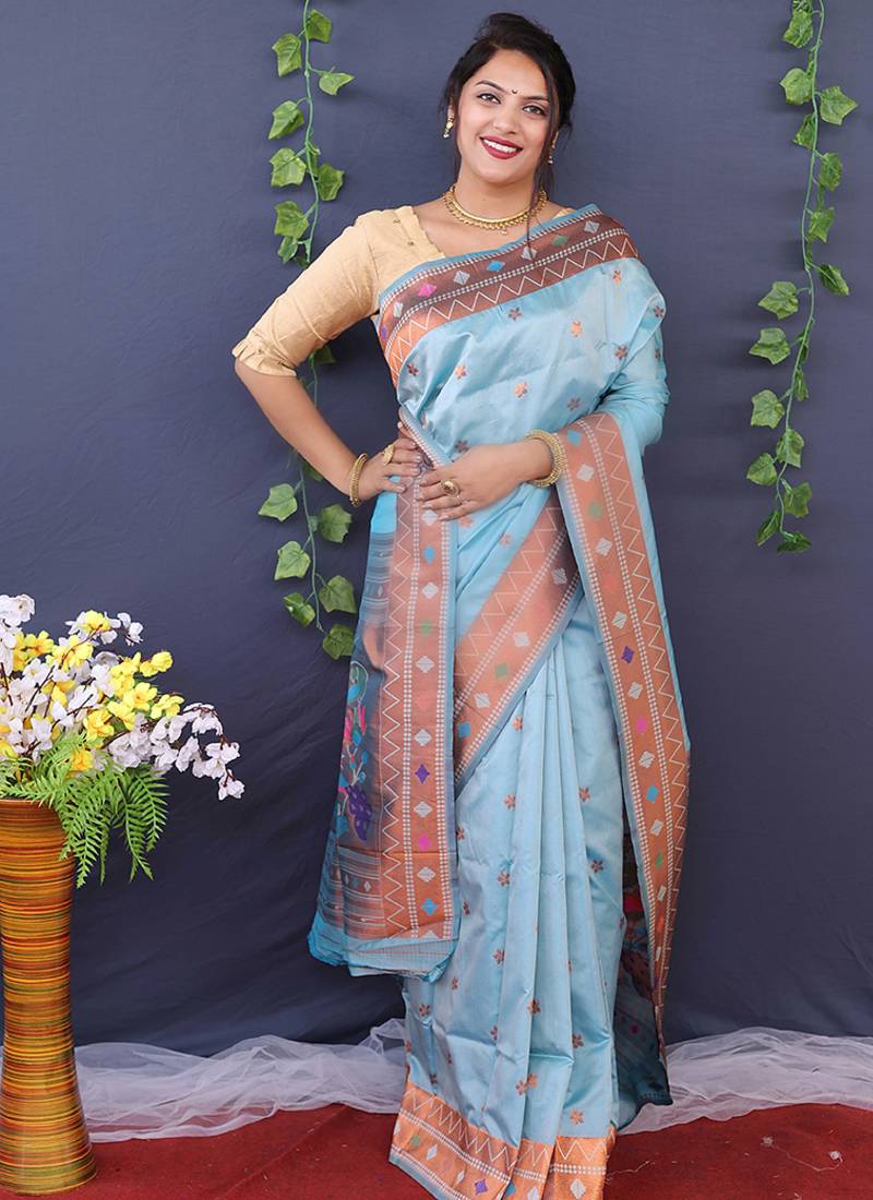 Sky blue banarasi silk blend saree with copper zari butti & geometric woven border