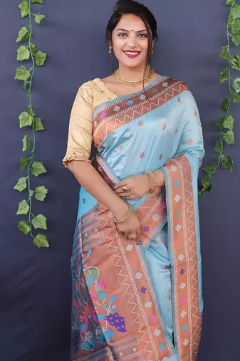 Sky blue banarasi silk blend saree with copper zari butti & geometric woven border