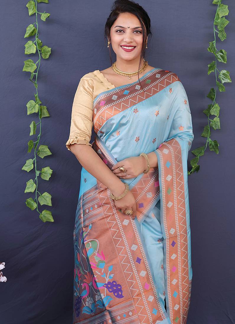 Sky blue banarasi silk blend saree with copper zari butti & geometric woven border