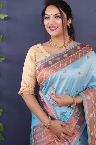 Sky blue banarasi silk blend saree with copper zari butti & geometric woven border