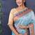 Sky blue banarasi silk blend saree with copper zari butti & geometric woven border