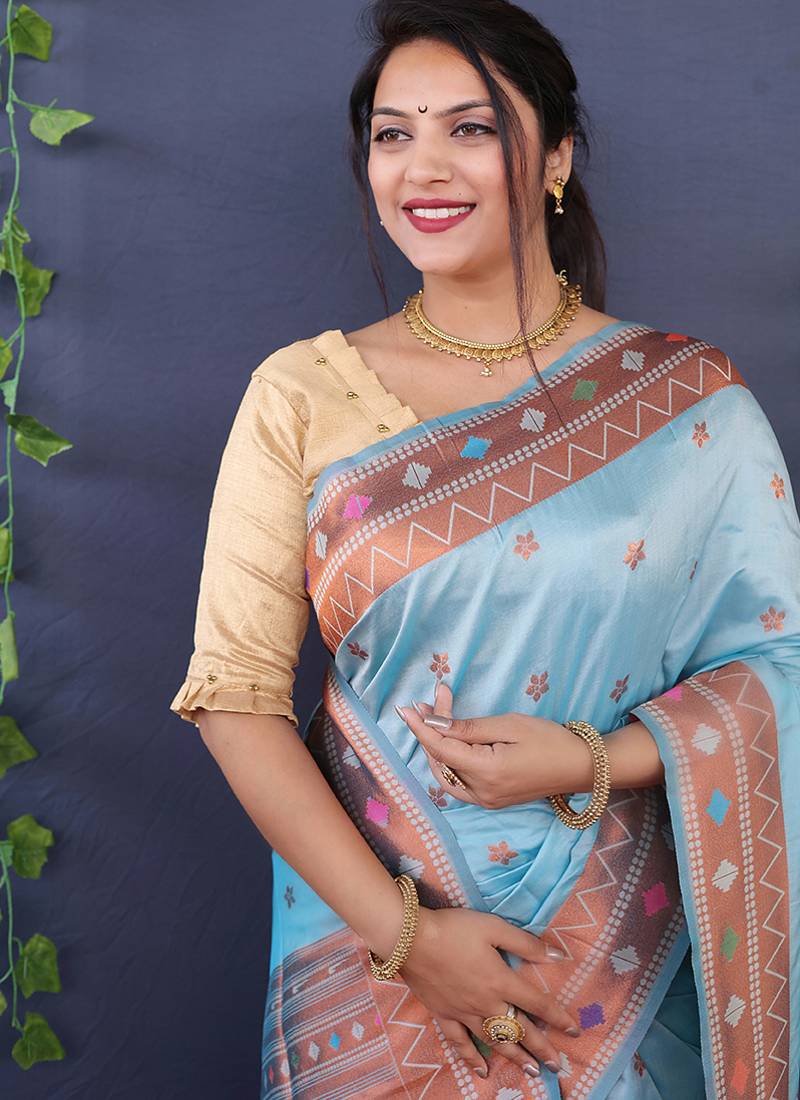 Sky blue banarasi silk blend saree with copper zari butti & geometric woven border