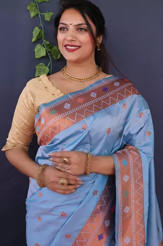 Sky blue banarasi silk blend saree with copper zari butti & geometric woven border