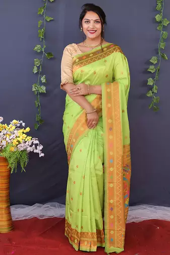 Light green banarasi silk blend saree with copper zari butti & geometric woven border