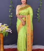 Light green banarasi silk blend saree with copper zari butti & geometric woven border