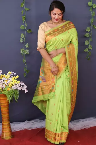 Light green banarasi silk blend saree with copper zari butti & geometric woven border