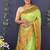 Light green banarasi silk blend saree with copper zari butti & geometric woven border