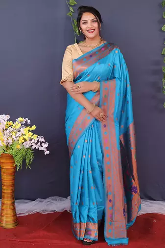 Aqua blue banarasi silk blend saree with copper zari butti & geometric woven border