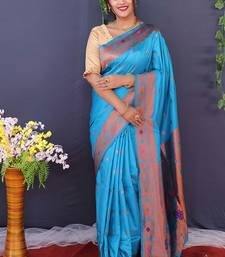 Aqua blue banarasi silk blend saree with copper zari butti & geometric woven border