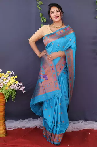 Aqua blue banarasi silk blend saree with copper zari butti & geometric woven border
