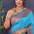 Aqua blue banarasi silk blend saree with copper zari butti & geometric woven border