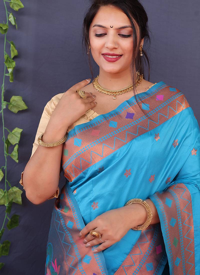 Aqua blue banarasi silk blend saree with copper zari butti & geometric woven border