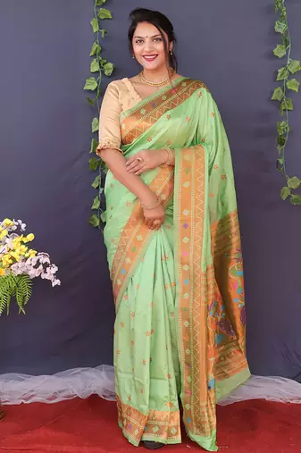 Mint green banarasi silk blend saree with copper zari butti & geometric woven border