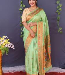 Mint green banarasi silk blend saree with copper zari butti & geometric woven border