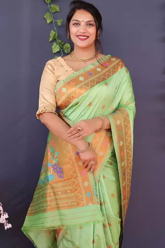 Mint green banarasi silk blend saree with copper zari butti & geometric woven border