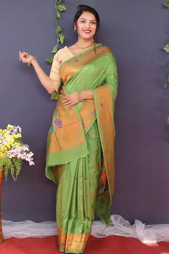 Leaf green banarasi silk blend saree with copper zari butti & geometric woven border