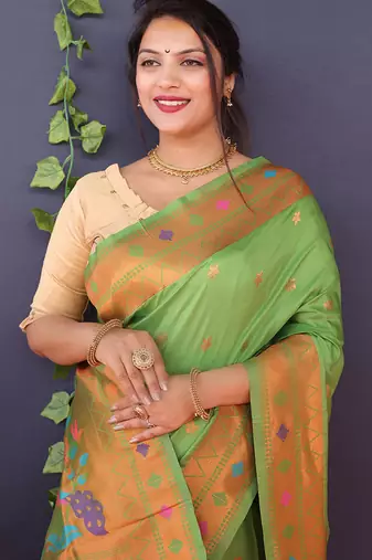 Leaf green banarasi silk blend saree with copper zari butti & geometric woven border