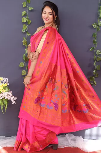 Rani pink banarasi silk blend saree with copper zari butti & geometric woven border
