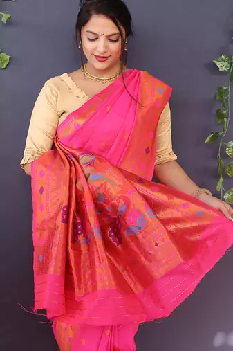 Rani pink banarasi silk blend saree with copper zari butti & geometric woven border