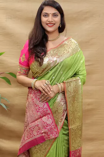 Light green banarasi silk blend saree with contrast border & rich zari weaving
