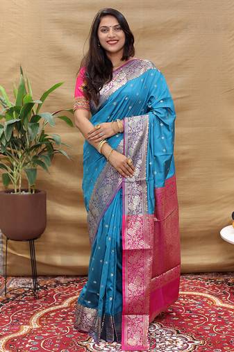 Sky blue banarasi silk blend saree with contrast border & rich zari weaving