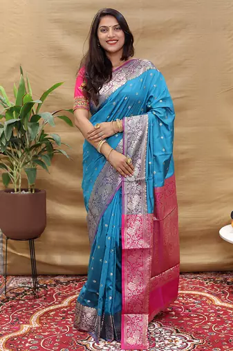 Sky blue banarasi silk blend saree with contrast border & rich zari weaving