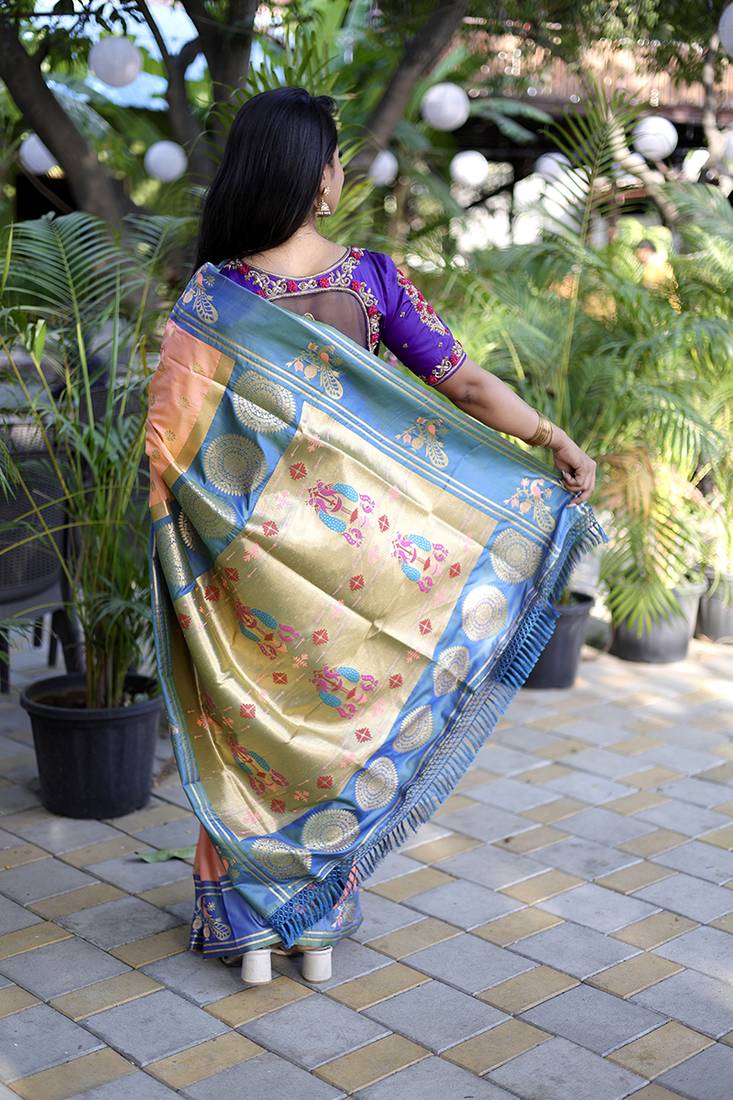 Peach paithani silk blend saree with contrast border & zari floral weaving